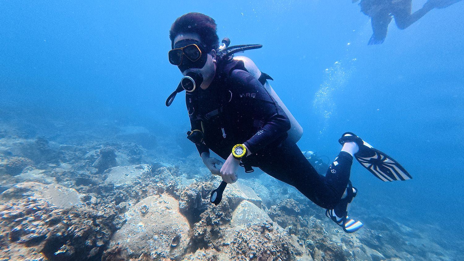 A new diver floating calmly above the reef in Nha Trang
